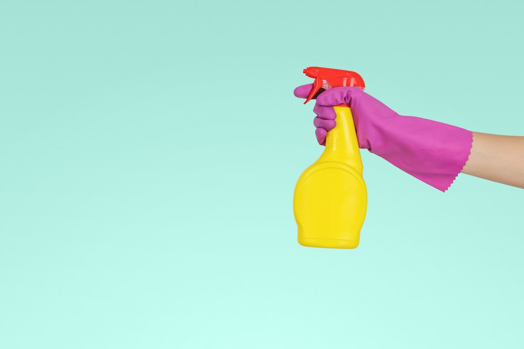 services-05 person-holding-yellow-plastic-spray-bottle-zmnefoi3k